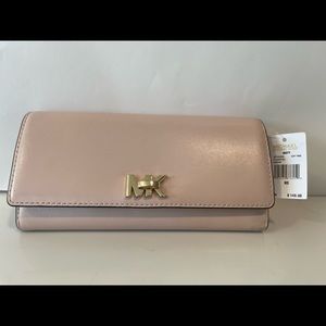 Michael Kors pink wallet, lightly use with tag.